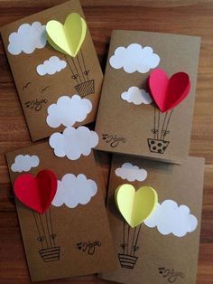 four valentine's day cards with hearts and hot air balloons in the shape of clouds