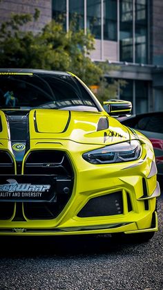 the front end of a yellow sports car