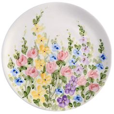 a white plate with colorful flowers painted on it