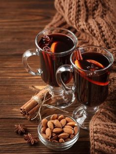 two mugs of mulled tea with cinnamon and star anise