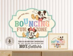 there is a sign that says bouncing fun zone and mickey mouse on the wall