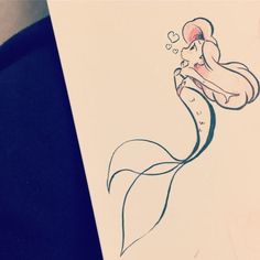 a drawing of a mermaid holding a heart