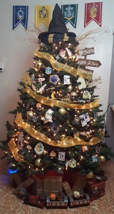 a small christmas tree decorated with gold ribbon