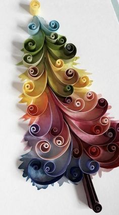 a colorful christmas tree made out of paper