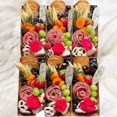 a box filled with lots of different types of food on top of a white table