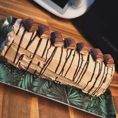 a cake with chocolate drizzled on it