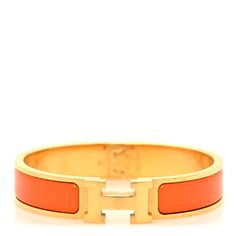 This is an authentic HERMES Enamel Narrow Clic Clac H Bracelet PM in Orange. This chic bracelet is made of gold-plated hardware with a swivel H and features an orange enamel inlay. Hermes Bracelet, Hermes Jewelry, Chic Bracelet, Plating, Orange, Things To Sell, Gold