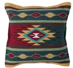 a decorative pillow with an arrow on it's back and multicolored stripes