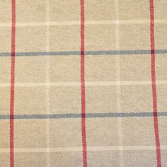 a close up view of a tan and red plaid fabric