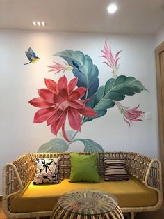 a living room with a couch and painting on the wall