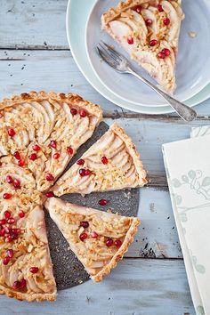 a piece of pie on a plate next to a fork and napkin with a slice missing from it