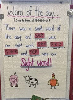 a bulletin board with words written on it and pictures of farm animals in the background