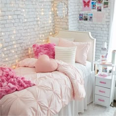 a bed with pink and white comforters in a girls'bedroom decorated for valentine's day