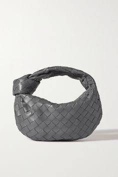 The signature intrecciato weave remains one of Bottega Veneta's most long-standing house codes - it's refined, elegant and instantly recognizable. Made in Italy, this 'Jodie' tote is masterfully assembled from strips of supple leather and has a softly rounded shape. The top handle is knotted at one side. Bottega Jodie, Bottega Veneta Bag Tote, Bottega Veneta Jodie Mini, Bag Wardrobe, Bottega Veneta Jodie, Mini Jodie, Shopping Wishlist, Bottega Veneta Bag