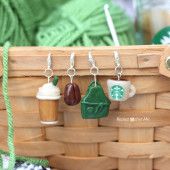 starbucks cup charms are hanging from a basket