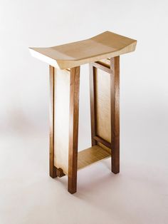 a wooden table sitting on top of a white floor