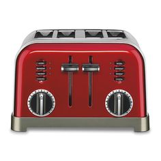 a red toaster sitting on top of a white table