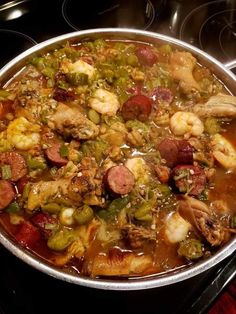 a large pot filled with lots of food on top of a stove