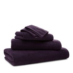 purple towels stacked on top of each other