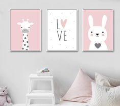 three pink and white wall art prints with giraffes, zebra, and heart shapes