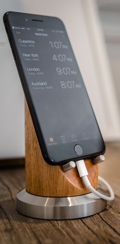 an iphone is plugged into a charging station