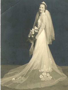 an old black and white photo of a bride