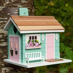 She Shed Birdhouse V2 Men have their man caves, and now, women are getting their own special spot: theSheShed.A great place for your backyard birds to escape, this fully functional birdhouse is adorned with a front bench, window box flowers, picket fence details and garden tools on the side barn doors. The mint and pink color combo make this the perfect backyard bird gal pal spot.This well-appointed birdhouse is complete with drainage ventilation, clean out and made of wood, the best material fo Bench Window, Large Bird Houses, Box Flowers, Wooden Bird Houses, Window Box Flowers, Pastel Color Schemes, Decorative Bird Houses, Man Caves, Wooden Bird