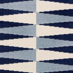 a blue and white area rug with horizontal lines on the top, diagonally drawn across it