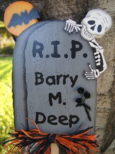 a sign that says rip barry m deep with a skeleton hanging from it's side