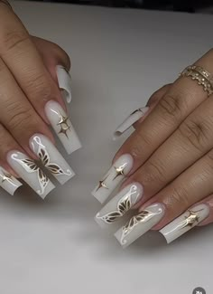 Nails Acrylic White Butterfly, White Butterfly Nails Acrylics, Trendy Nails Classy, White Angel Nails Acrylic, White Acrylic Nails Coffin Butterfly, Baddie Long Acrylic Nails, Hard Nail Designs, White Gold Butterfly Nails, Vibrant Nails