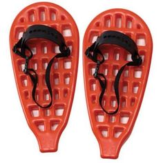 pair of red snowshoes with black straps on white background