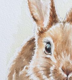 a watercolor painting of a rabbit's face with blue eyes and brown ears