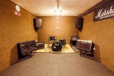 a recording studio with speakers and amps