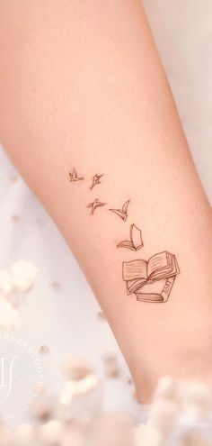 30 BEAUTIFUL BOOK TATTOOS THAT WILL INSPIRE YOU! Cute Small Book Tattoos, Small Reader Tattoo, Literary Quotes Tattoos, Book To Bird Tattoo, Verity Tattoo Designs, Bird Book Tattoo, Cute Book Tattoos For Women, Heart Book Tattoo, Bird And Book Tattoo