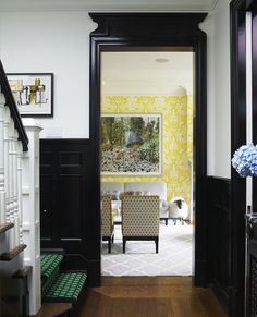 an entry way leading to a dining room