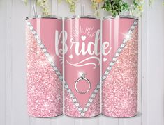 three pink glitter wedding can coolers with the bride and groom's rings on them