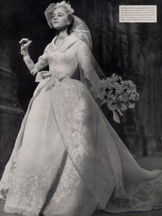 an old photo of a woman in a wedding dress