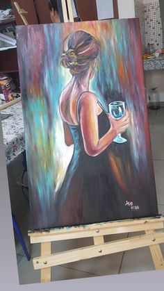 a painting of a woman in a black dress holding a wine glass on an easel