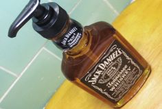 a bottle of jack daniels sitting on top of a counter next to a banana peel