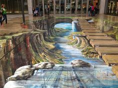 an artistic painting on the ground in front of a building