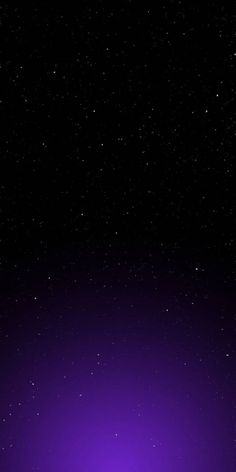 an image of the night sky with stars in it and purple light shining on the ground