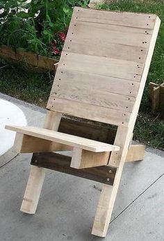 a wooden chair sitting on top of a sidewalk