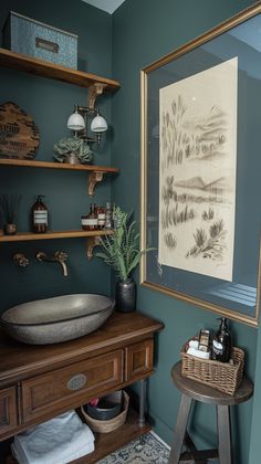 a bathroom with green walls and wooden shelves on either side of the bathtub is an antique washbasin