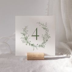 a card with the number four printed on it and a rubber stamp in front of it