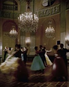 a group of people dancing in a ballroom