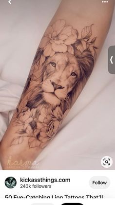 a woman's arm with a lion and flowers on it