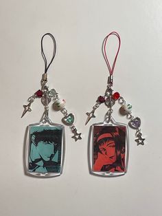 two necklaces with anime characters hanging from them