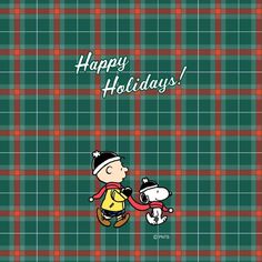 a man holding a dog in front of a plaid background with the words happy holidays written on it