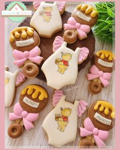 some cookies are decorated with winnie the pooh and baby ones on top of each other