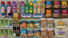 an assortment of food items are displayed on a shelf